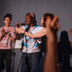 Gold Comedy co-hosts Jes Tom, Elsa Waithe and founder Lynn Harris warm up the audience.